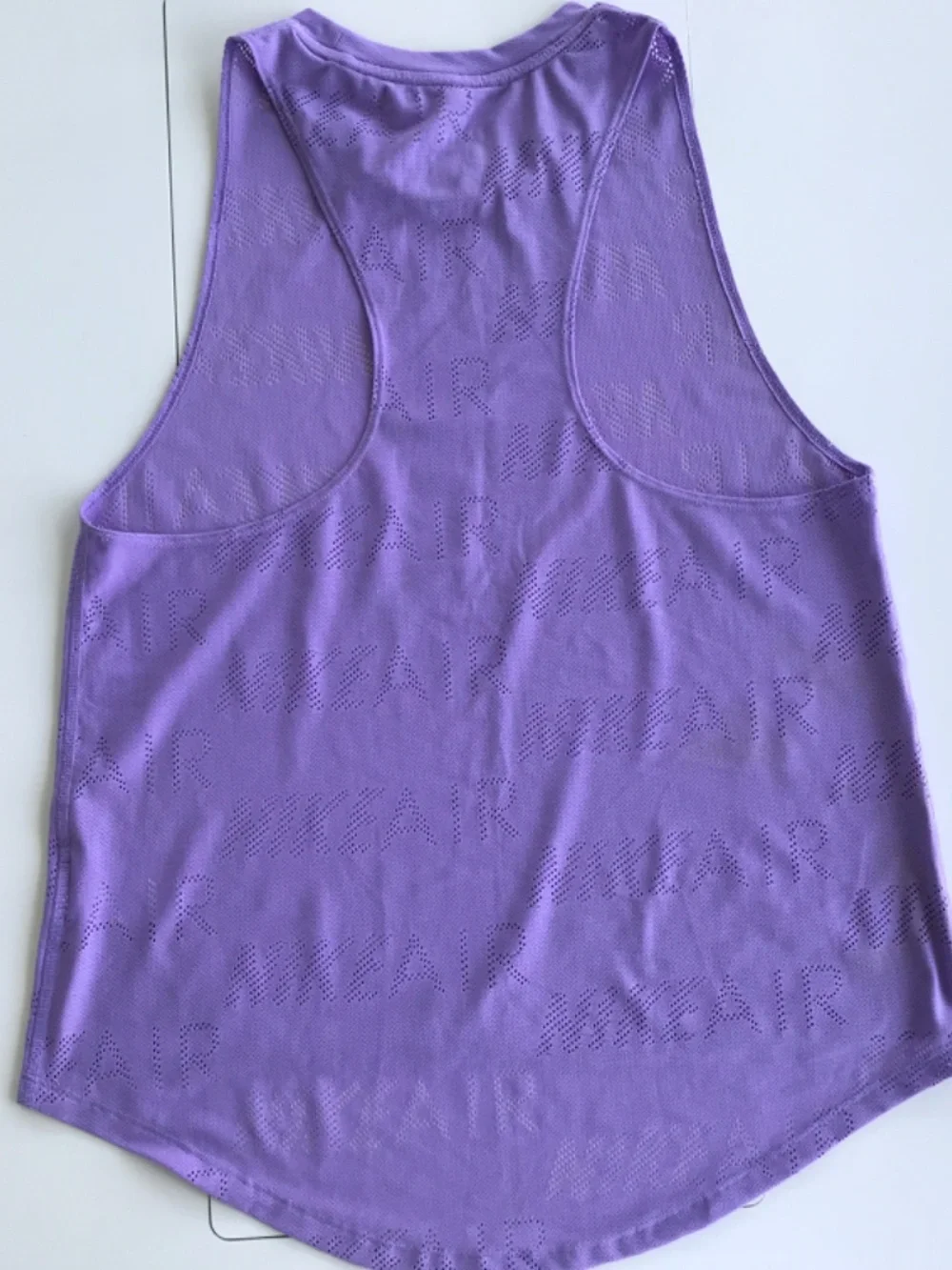 TWO Nike athletic tops. M, DRI Fit and laser cut patterns.